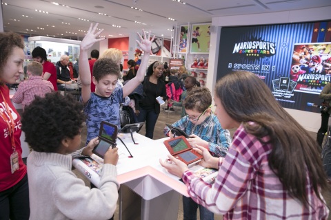 In this photo provided by Nintendo of America, Luke P., Harrison P., Natalie P., and Tristan B. compete in baseball to be named MVP of the Mario Sports Superstars game at the Nintendo NY store in Rockefeller Plaza on Friday, March 24. Mario Sports Superstars is an action-packed Nintendo 3DS game that finds players competing in five full-featured sports: Baseball, Soccer, Golf, Tennis and Horse Racing. (Photo: Business Wire)
