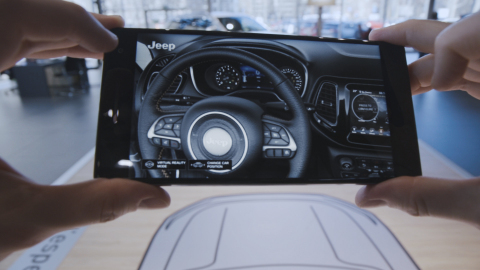The Accenture-developed app allows car buyers to hold a Tango-enabled device and view, walk around, look inside and configure a life-size virtual Jeep Compass (Photo: Business Wire)