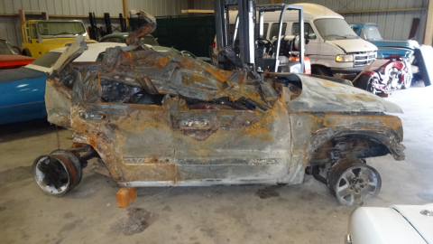 Post-accident view of the Almanza and Urquiza family’s burned-out Jeep Liberty. (Photo: Business Wire)