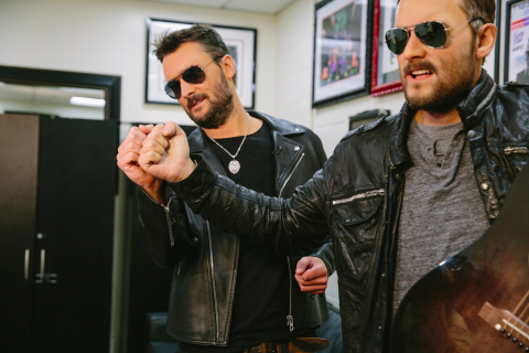 Eric Church compares features to his brand-new wax figure for Madame Tussauds Nashville. (Photo: Business Wire)