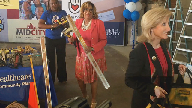 B-roll of First Lady Edwards, UnitedHealthcare employees and volunteers loading construction material into a trailer set to go into the community to help in the repair of damaged residences and storefronts (Video: Kevin Herglotz).