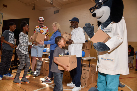 Irene Myers-Thompson, wellness director of UnitedHealthcare Mid-Atlantic; Andrew Hoxie of the Baltimore Blast; and UnitedHealthcare mascot Dr. Health E. Hound passed out 150 NERF ENERGY Game Kits to members of the Boys & Girls Clubs of Metropolitan Baltimore. The local youth were led through exercises and basketball drills to test out their new NERF ENERGY Game Kit, which tracks activity earning "energy points" in order to play the game. The donation is part of a recently launched national initiative between Hasbro and UnitedHealthcare, featuring Hasbro's NERF products, that encourages young people to become more active through "exergaming." (Photo by: Michael Ciesielski)