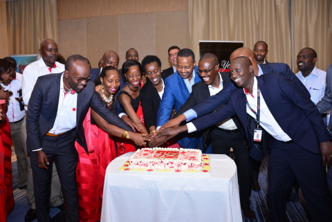 Rwanda's Minister of Health,  AHF staff and Partners cut the anniversary Cake. (Photo: Business Wire) 