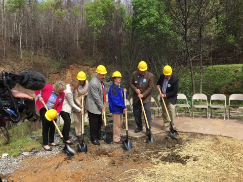Members of the Mountain Tough Recovery Team, the Appalachia Service Project and area leaders break ground on a new home for Glenna Ogle (blue jacket) in Gatlinburg, Tennessee on Tuesday morning. (Photo: Business Wire)