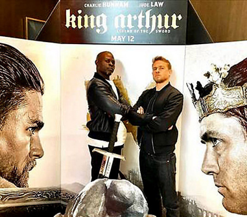 L-r Djimon Hounsou and Charlie Hunnam stop by NYC theater for King for a Day advance screening of "King Arthur: Legend of the Sword," in theaters May 12 (Photo: Business Wire)