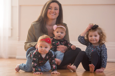 Katie Ockerman, a Fifth Third financial center manager, says the Bank's Maternity Concierge program helps her balance work and life. She is a mom to 10-month-old twins, Madilyn (left) and Cora (in lap) and 2-year-old Naomi. (Photo: Business Wire)