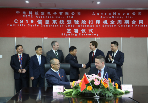 Greg Woods (standing, second from right), president and CEO of AstroNova, and Chen Guohai, general manager of China Electronics Technology Avionics (CETCA), shake hands during an April signing ceremony at CETCA's headquarters in Chengdu, China. The ceremony commemorated an exclusive contract under which AstroNova will provide its ToughWriter 5® flight deck printer for the CETCA supplied Information System on the new COMAC C919 passenger jet, manufactured by the Commercial Aircraft Corporation of China. AstroNova announced the agreement with CETCA on May 15, 2017. (Photo: Business Wire)