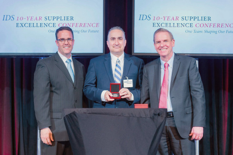 David Pearson, President of LCR Embedded Systems, at center accepting award from John Bergeron (left) and Michael Shaughnessy (right) of Raytheon. (Photo: Business Wire)