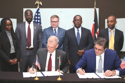 U.S. Ambassador to Kenya, Robert F. Godec, signs the grants on behalf of USTDA, along with Xago Africa Managing Director, Paul W. Webb. (Photo: Business Wire)