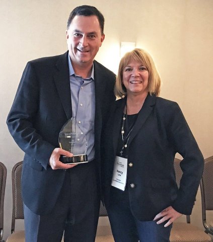 Propel Marketing's CEO Peter Cannone accepts the award from Nancy Lane, President of LMA, for Best Digital Agency on behalf of Propel at Local Media Association's Digital Revenue Summit. (Photo: Business Wire).