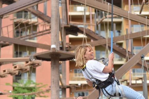 After making it to the top of the rock-climbing wall, actress and mom Candace Cameron Bure takes in the sights during her descent at Kalahari Resorts and Conventions in Sandusky, Ohio. (Photo: Business Wire)