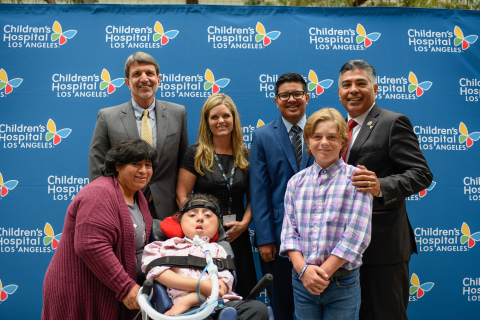 (Left to right) Back row: Paul S. Viviano, CHLA president and CEO; Jennifer Page; Cristian Mendoza, patient; Rep. Tony Cárdenas (D-Calif.). Front row: Evelyn Morales; Connie Morales, patient; Max Page, patient. (Photo: Children's Hospital Los Angeles)