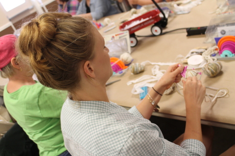 A JOANN workshop attendee works diligently on her project. (Photo: Business Wire)