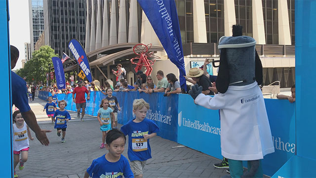 More than 160 kids crossed the finish line at the UnitedHealthcare IRONKIDS Raleigh Fun Run today at Raleigh Marriott City Center. UnitedHealthcare mascot Dr. Health E. Hound helped Derek K. Harris Jr. of UnitedHealthcare and state Rep. Duane Hall kick off the fun run. This is the sixth year UnitedHealthcare is sponsoring IRONKIDS races in the United States. (Video credit: Marc Kawanishi)