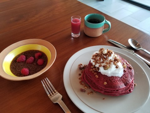 Andaz Scottsdale's Red Velvet Pancakes with Whip Cream and House Made Granola accompanied by Pomegranate Chia Seed Pudding. The hotel is participating in the EAT (RED) SAVE LIVES campaign, and every order of this special breakfast triggers a $3 donation from the hotel that goes directly to (RED)’s fight. (Photo: Business Wire)
