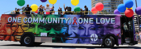 AHF's "One Community, One Love" custom-wrapped bus is scheduled to appear in Pride parades in U.S. cities including Brooklyn (6/10); Long Island (6/11); Washington, DC (6/10); Columbus, OH (6/16); Houston (6/24); New York City, NY (6/25); San Diego (7/15); Oakland, CA (9/10); Dallas (9/16); Atlanta, GA (10/14); and Las Vegas (10/20). (Photo: Business Wire) 