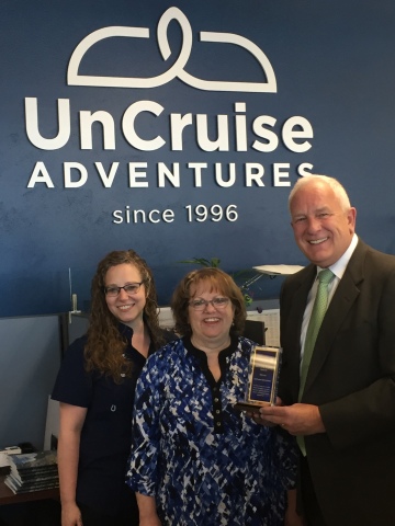UnCruise Adventures -- From left to right: Juniper Rayne, Fulfillment Coordinator, UnCruise Adventures; Wendy Wilford, Marketing Manager, UnCruise Adventures; and Doug MacDonald, Major Accounts Manager, Pitney Bowes (Photo: Business Wire)