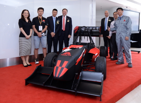 Members of Axalta and Shanghai Tongji University celebrate the university team race car which was painted with Axalta’s Spies Hecker® refinish products. (Photo: Axalta)
