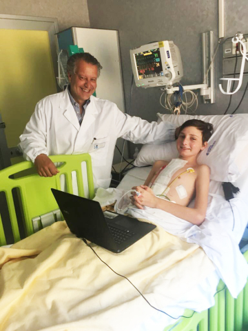 Andrei, 12, is the world’s youngest patient to be bridged to transplant with the SynCardia Total Artificial Heart. He is pictured after his heart transplant with his surgeon Dr. Antonio Amodeo at Bambino Gesù Children’s Hospital in Rome, Italy. (Photo: Business Wire)