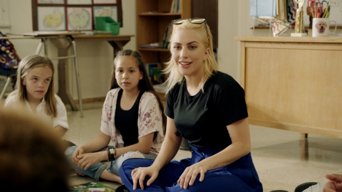 Lady Gaga is teaming up with Staples, Inc. to support education and create a positive classroom experience through its Staples for Students program. Lady Gaga recently met with students in California during the filming of the upcoming Public Service Announcement for DonorsChoose.org and Born This Way Foundation. (Photo: Business Wire)