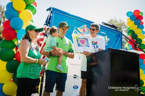 Children's Hospital Los Angeles President and CEO Paul S. Viviano honors the Becerra family, who participated in Walk L.A. in loving memory of their son Rex. Their team Rex and the Heart Beaters raised more than $106,000 to date for CHLA. (Photo: Business Wire)