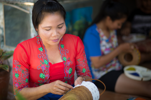 Wayan is a Balinese artisan who specializes in batik and beaded baskets and handbags. She uses her Kiva loan to invest in the purchase of such raw materials as beads and baskets for production. Photographer: Brandon Smith