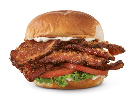 A slice of Arby’s new Triple Thick Brown Sugar Bacon is nearly a quarter of an inch thick, more than three times the girth of a typical slice. (Photo: Business Wire)