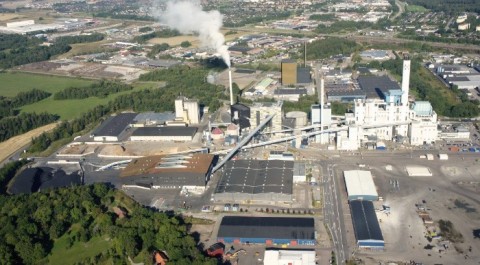 Photo montage by Scheiwiller Svensson Arkitektkontor AB. The image shows the location of block 7, golden and black colored building beyond the power plant, seen from the south.