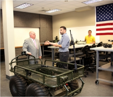 Shahar Abuhazira, CEO of Roboteam and Maryland Governor Larry Hogan in front of the PROBOT. (Photo: Business Wire)