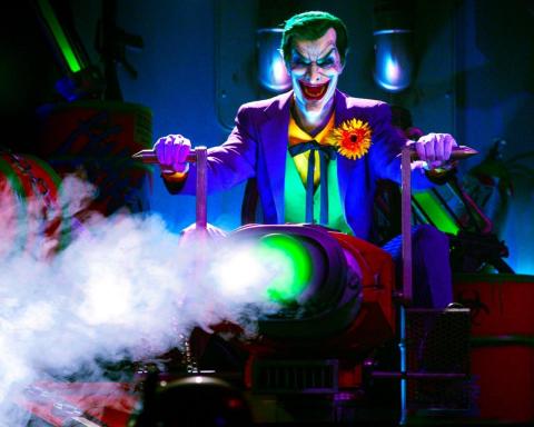 The Joker sprays laughing gas on riders at Six Flags Magic Mountain’s new JUSTICE LEAGUE: Battle for Metropolis attraction. Riders are members of the JUSTICE LEAGUE Reserve Team to save the City of Metropolis with climactic interactive battle scenes between the DC Super Heroes and Super-Villains. (Photo: Business Wire)