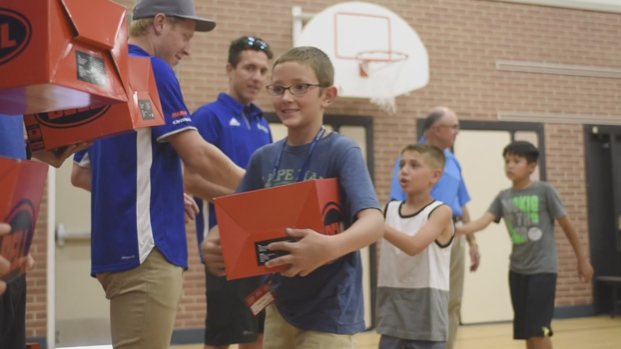 B-Roll – Boys & Girls Club kids at Hawthorne Elementary receive new helmets from UnitedHealthcare Pro Cycling team members (Video: Chad Case).