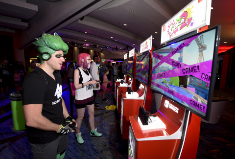 In this photo provided by Nintendo of America, cosplayers Heidi O’Ferrall and Leo Camacho engage in Splatoon 2 gameplay while in their Splatoon 2-inspired costumes. The Splatoon 2 game launches on July 21 exclusively for the Nintendo Switch system. (Photo: Business Wire)