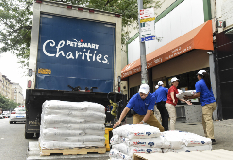 A PetSmart volunteer team helps unload one of 10 pallets of donated pet food for the Food Bank for New York City’s Community Kitchen & Food Pantry, Tuesday, Aug. 15, 2017, in the Harlem neighborhood of New York. This delivery is part of the first of four massive pet food donation waves from PetSmart’s Buy a Bag, Give a Meal program, where for every bag of dog or cat food purchased online or in its 1,500-plus stores through Dec. 31, 2017, the retailer will donate a meal to a pet in need. Nonprofit partner, PetSmart Charities, is directly managing the pet food distribution across North America.  For more information visit petsmart.com/giveameal. (Photo by Diane Bondareff/AP Images for PetSmart)