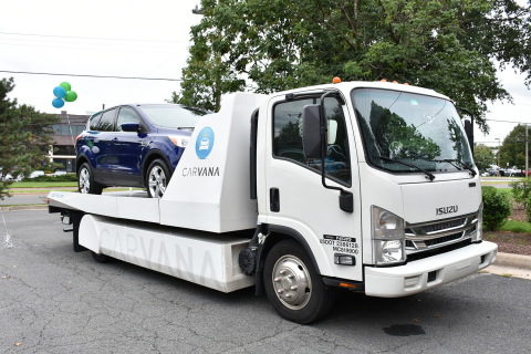 The Carvana car carrier delivers the raffled car (Photo: Business Wire)