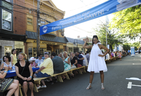 Actress Tia Mowry joins the town of Lambertville, NJ at a 2,000 foot table for the Family Dinner with Dawn event, Sunday, Aug. 13, 2017. While they ate, Dawn tackled over 6,000 dishes using one 21.6 oz bottle of Dawn. (Photo by Diane Bondareff/Invision for Dawn/AP Images)