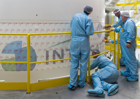 The Intelsat 37e launch team applies the Intelsat logo to the Ariane 5 launch vehicle in preparation for the September 5 launch. (Photo: Business Wire) 