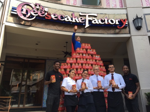 The Cheesecake Factory staff members from Aventura, FL display peanut butter collected for the local Feeding America food bank in 2016 (Photo: Business Wire)