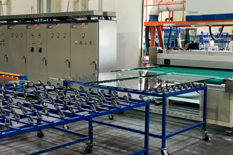 Glass moves to tempering machine after horizontal wash at Triview Glass (Source: SolarWindow Technologies, Inc.)