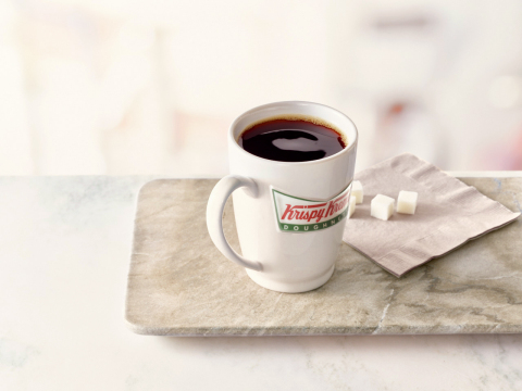 Krispy Kreme Doughnuts announced that it will spread the joy of National Coffee Day over an entire weekend, offering guests one free cup of coffee each day, Friday, Sept. 29 through Sunday, Oct. 1. Customers can enjoy any sized hot brewed or small iced premium blend coffee for free at participating Krispy Kreme shops across the United States and Canada. (Photo: Business Wire)