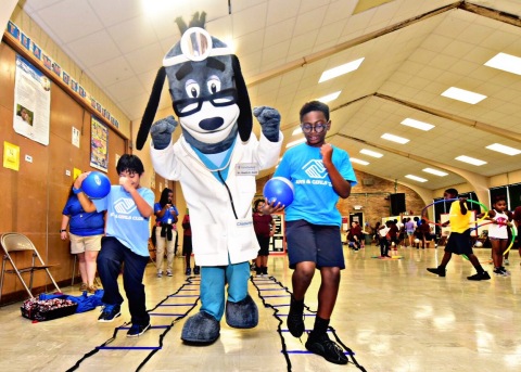 Nearly 100 members of the Boys & Girls Clubs of Greater Baton Rouge and UnitedHealthcare mascot Dr. Health E. Hound tested out their new NERF ENERGY Game Kit that tracks activity earning "energy points" in order to play the game. The donation is part of a national initiative between Hasbro and UnitedHealthcare, featuring Hasbro's NERF products, that encourages young people to become more active through "exergaming" (Photo: Cheryl Gerber).