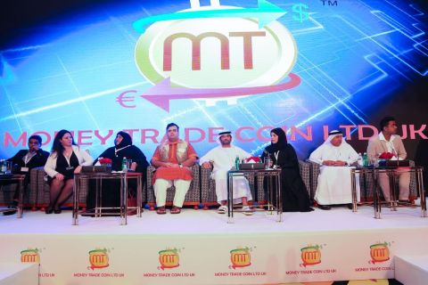The panel at Money Trade Coin Ltd UK Global Press Conference - Allwyn Prabhakar, Sammar Asaf, Salma Al Ketbi, Amit Lakhanpal, H.E. Sheikh Saqer Al Nahyan, Nada Almawy, Hashim Malik and Taha Kazi (Photo: AETOS Wire)