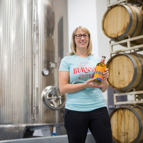 Mel Heim is the executive vice president of operations and Eastside Distilling's master distiller. Eastside's tasting rooms are celebrating the launch of their new product with complimentary T-shirts for patrons who say "Mel Heim sent me," until Oct. 8. (Photo: Business Wire)