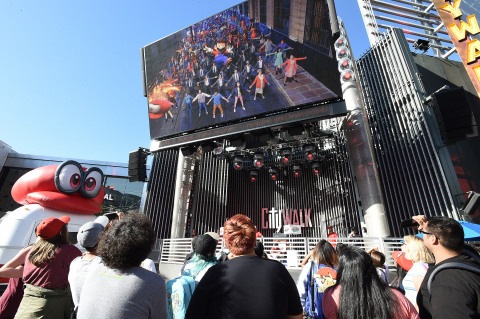 In this photo provided by Nintendo of America, fans watch the world premiere of the “Jump Up, Super Star! – Super Mario Odyssey Musical” video, featuring a jazz-themed song from the game. Fans gathered at Universal CityWalk in Los Angeles to celebrate the launch of the Super Mario Odyssey Tour, which will take Mario to five special stops across the country, ending in New York on Oct. 26, the eve of the game’s launch exclusively for the Nintendo Switch system. (Photo: Nintendo of America)