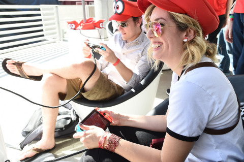 In this photo provided by Nintendo of America, YouTube personalities Meghan C. of Strawburry17 and Roger D. of RogersBase play the Super Mario Odyssey game on the Nintendo Switch system at the Super Mario Odyssey Tour Kick-off Event at Universal CityWalk in Los Angeles. Fans had the opportunity to demo the game and meet Mario at the start of his cross-country tour to celebrate his new game, Super Mario Odyssey, which launches exclusively for Nintendo Switch on Oct. 27. (Photo: Nintendo of America)