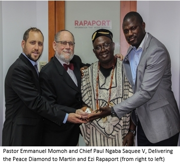 Pastor Emmanuel Momoh and Chief Paul Ngaba Saquee V, Delivering the Peace Diamond to Martin and Ezi Rapaport (from right to left) (Photo: Business Wire)