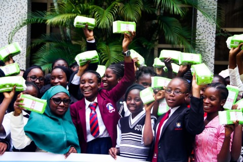 Young girls receive free sanitary pads from AHF (Photo: Business Wire)