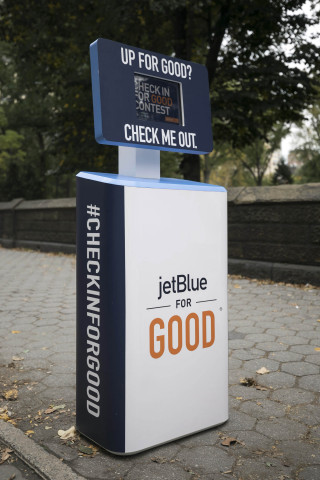 During JetBlue For Good Month, the airline is asking customers to #CheckInForGood at kiosks in New York and Los Angeles and enter to win a complimentary trip to volunteer with some of the airline’s non-profit partners. (Photo: Business Wire)