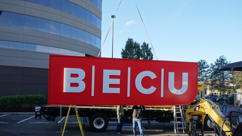 Unveiled today, BECU installs its new logo on the Tukwila Financial Center headquarters. (Photo: Business Wire)