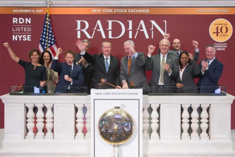 Radian’s senior leadership team cheer after CEO Rick Thornberry rings the closing bell at the NYSE. (Photo: Business Wire)