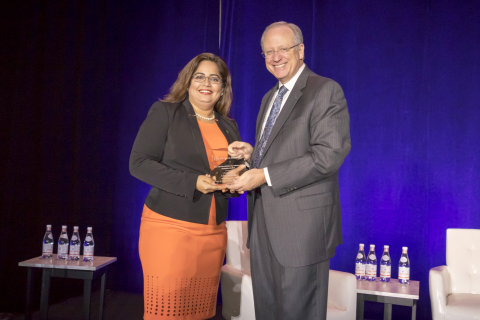 Liza Mistry of TD Bank receives from Wolters Kluwer's Timothy Burniston the 2017 Alfredo deHaas Excellence in Analytics Award (Photo: Wolters Kluwer).